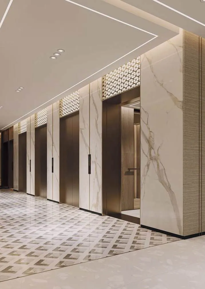 Sảnh thang máy ốp đá marble với cửa tầng inox